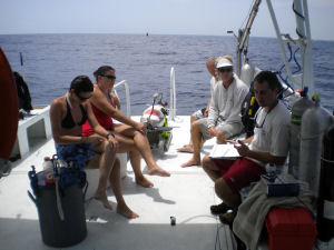 The Expedition team takes a break for a live, at-sea webinar. Note the webcam on Chris' left.