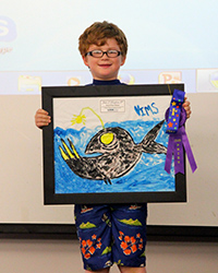 1st grader Johnny Vaughan of Williamsburg won the 2014 Marine Science Day art contest with his colorful anglerfish painting.