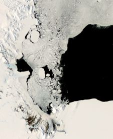 Sea ice covers a large part of the Ross Sea in this summer 2007 photo. A large opening in the ice cover, or polynya, extends to the east. Photo courtesy of NASA.