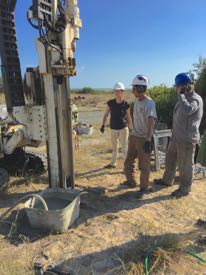 Hein works with graduate student Justin Shawler and lab technician Jennifer Connel to take a sediment core using their Geoprobe drill rig.