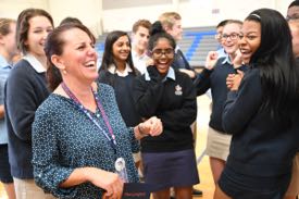 Students congratulate Tami Lunsford on her surprise award. © Milken Family Foundation.