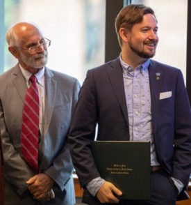 Graduate Chase Long (R) with VIMS Dean and Director John Wells (L) during the VIMS Diploma ceremony. © N. Meyer/W&M.