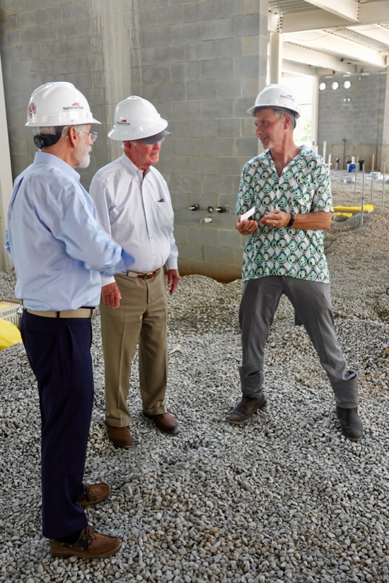 Dr. Walton (R) speaks with Marshall Acuff, Jr. (C) and then VIMS Dean & Director Dr. John Wells during the "topping-off" ceremony for the future Acuff Aquaculture Center. © D. Malmquist/VIMS.