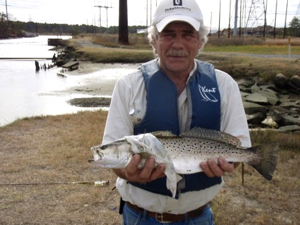 Veteran Dave Conklin with a speckled trout that he caught during a Project Healing Waters outing at the Hot Ditch. Photo courtesy of Susanna Musick.