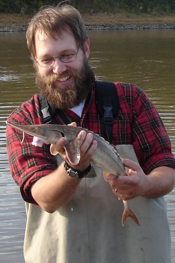 VIMS professor Eric Hilton holds a shovelnose sturgeon (Scaphirhynchus platorynchus) from the Missouri River.