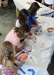 Participants take part in a fish printing activity at Marine Life Day. ©Stephanie Bonniwell
