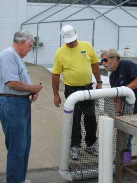 TOGA members Ray Hook, Jim Renner, and Steve Wann learn about constructing a Taylor Float during the training course. Photo courtesy of Vic Spain.