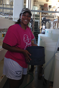OAT intern Imani Black working inside VIMS' oyster hatchery. Photo: ABC/VIMS