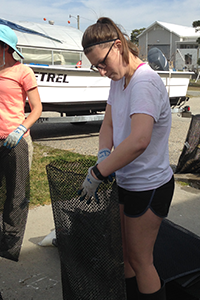 OAT intern Haley Ladeau works outside VIMS' oyster hatchery. Photo: ABC/VIMS