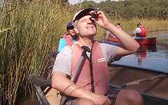 A participant uses a refractometer to measure salinity during the canoe trip on Taskinas Creek. Photo by Sarah Nuss.