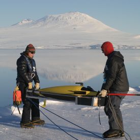 VIMS professor Walker Smith (L) deploys a glider into the icy waters of Antarctica's Ross Sea.