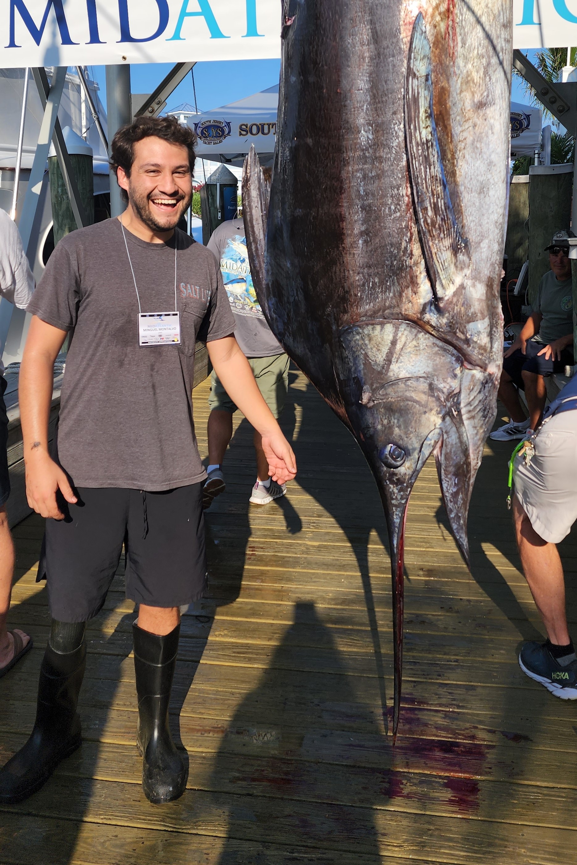 This is me at a fishing tournament with an enormous Atlantic Blue Marlin - this was my first time seeing a fish of this size! We collect data from tournaments like this to help us assess the health of fish stocks. Some of these fishes are sometimes donated to us and become part of the Nunnally Ichthyology Collection that houses specimens that can be used by researchers all over the world.
