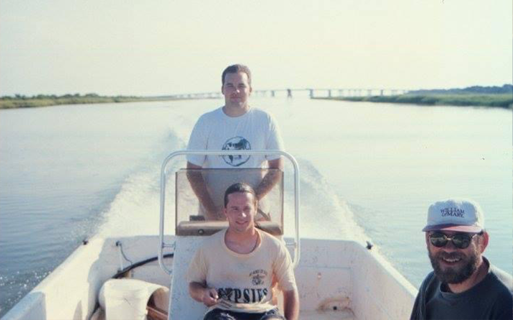 Holmquist (back) conducting field work on the Eastern Shore with Michael Wagner M.S. '97 (front left) and Peter Van Den Hurk Ph.D. '98 (front right).