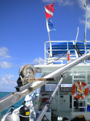 Research Vessel George F. Bond flying the American diver down flag (top) and the international diver down flag (bottom)