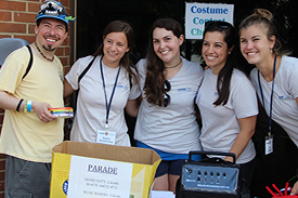 (L to R) Matthew Denton poses with VIMS graduate students Taylor Armstrong, Liese Carlton, Bianca Santos, and Lisa Ailloud during Marine Science Day, 2015. Photo by Erin Fryer.