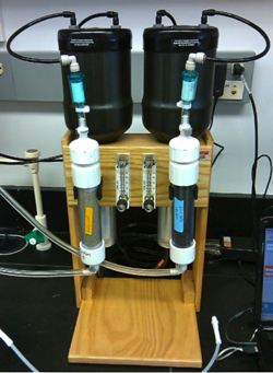 The experimental set-up that professor Aaron Beck uses to measure the amount of radium tracer in seafloor and beach sediments. Photo by Aaron Beck.