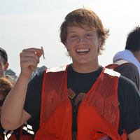 REU student Joseph Matt holds up his “big catch,” an anchovy caught along the seaside Eastern Shore.