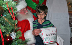 Avery Gibbs with Santa during his visit.