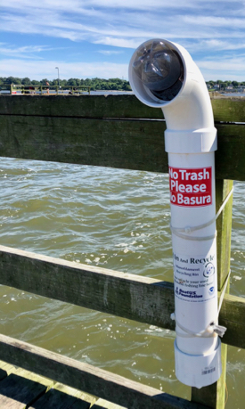 A monofilament recycling receptacle on the Gloucester Point Fishing Pier. Note the plastic bottle blocking the opening.