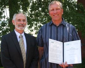 Orth (R) was honored with the 2011 Outstanding Faculty Researcher Award from VIMS. Presenting the certificate is VIMS Dean and Director John Wells.