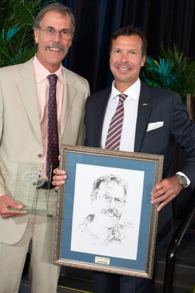 Before the IGFA’s refusal to consider his fish for world-record status, Graves had actually been elected to their Fishing Hall of Fame. Presenting the award is IGFA President Rob Kramer (R). © Debra Todd Photography. 