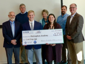 Jacob Ward, a senior at Walsingham Academy in Williamsburg, holds his 1st-place check along with mentor Rebecca Thomchick. From L: VIMS Dean & Director John Wells, David Weiss of CCRM, Ward, Executive Director of Clean Virginia Waterways Katie Register, Thomchick, David Stanhope of CCRM, and Virginia State Senator Monty Mason. 