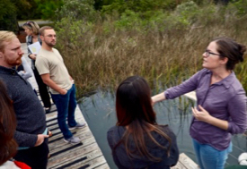 Mitchell (R) explains to students from the Virginia Coastal Policy Center how sea-level rise affects the management of marshes. © Aileen Devlin/Virginia Sea Grant.