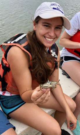 Kayla Rutherford holds a blue crab collected during the REU's annual visit to VIMS Eastern Shore Lab in Wachapreague. © R. Seitz/VIMS.