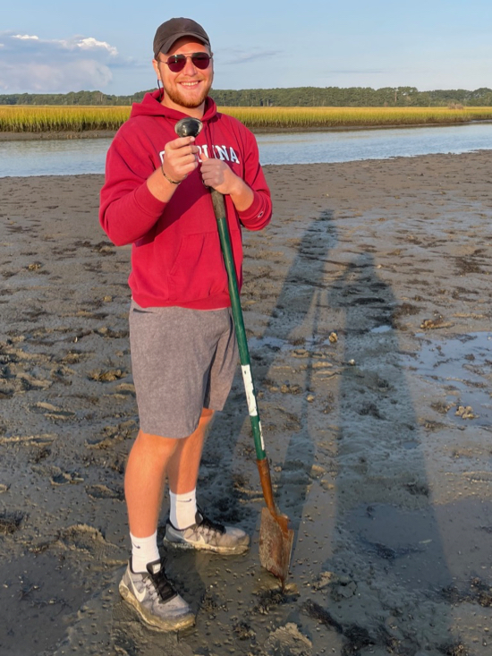 MA student Will Shoup explores a tidal mudflat during the annual new-student field trip to Virginia’s Eastern Shore and VIMS’ Eastern Shore Laboratory. © J. Griffin/VIMS.