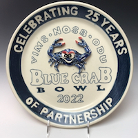 A special plate commemorates the 25th-annual Blue Crab Bowl.
