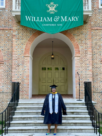 Taylor Walker (MS '22) celebrates her new Master's degree on the steps of the Wren Building at William & Mary. © J. Griffin/VIMS.