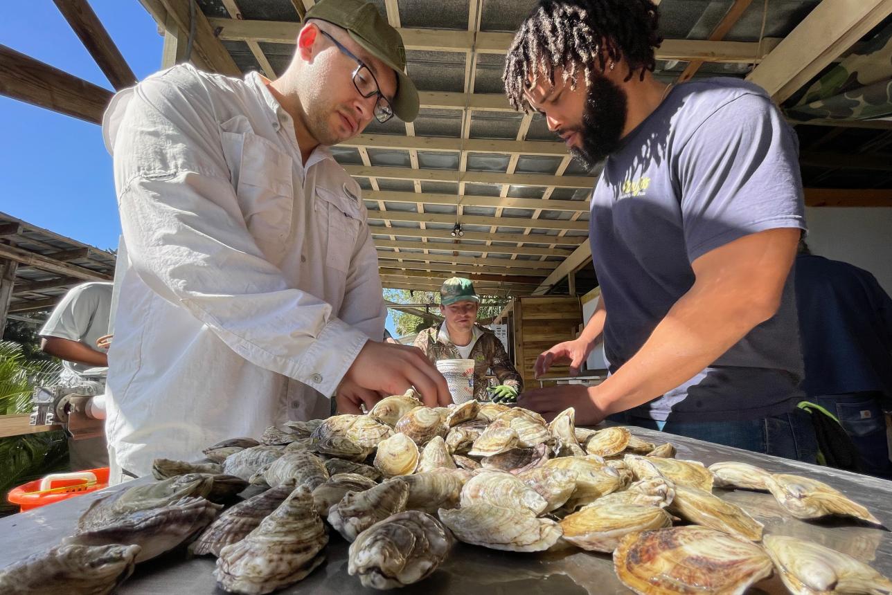 Matt LaGanke (left) plans to utilize his Ph.D. and sub-concentration in shellfish aquaculture to strengthen the connection between academic research and aquaculture farm practices.