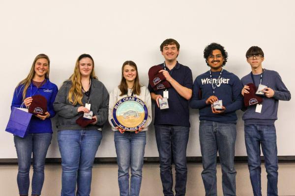 Blue Crab Bowl winners New Horizons Governor's School of Science and Technology poses with their trophy.