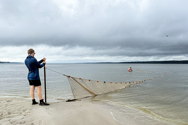 Scientists sample each survey site five times, deploying a 100-foot seine net from the shore. Photo by Jack Buchanan. 