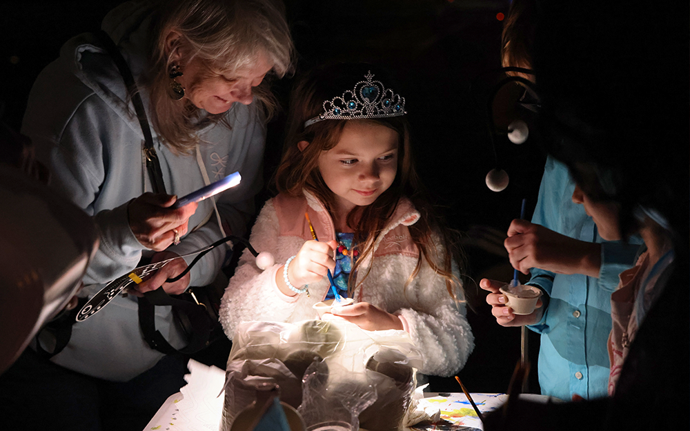 Interactive booths let attendees get hands-on with marine science crafts and other activities.