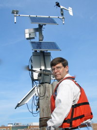 VIMS professor John Brubaker checks the VIMS weather station.