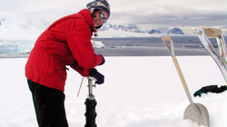 VIMS researcher Rebecca Dickhut takes an ice core in Antarctica.