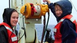 VIMS graduate student Grace Henderson (L) and post-doctoral associate Sarah Goldthwait (R) on the deck of the R/V Oceanus during the June 2004 EDDIES expedition to the North Atlantic.