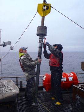 VIMS graduate student Eric Miller (L) and professor Steve Kuehl (R) prepare to core seafloor sediments in Prince William Sound, Alaska.