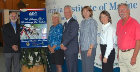 VIMS Dean and Director John Wells joins with representatives from EVB and Gloucester County to unveil the poster for the Return To The Hook event. From L: Wells, Lisa Jackson (Branch Manager, EVB Gloucester), Andy Mullins (EVB Small Business Relations Manager), Carol Steele (Director Gloucester County Parks, Recreation, and Tourism), Anita Ottarson (Branch Manager, EVB Gloucester Point), and Hilton Snowdon (Gloucester County Tourism Coordinator).