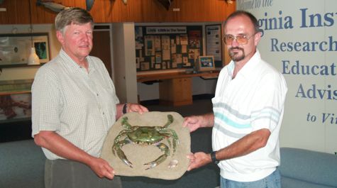 VIMS crab expert Jacques van Montfrans (L) and Eastern Shore taxidermist Arty Meredith display what may be the largest crab ever recorded from Chesapeake Bay.