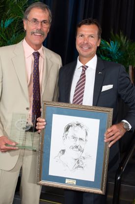 IGFA President Rob Kramer (R) presents Dr. John Graves with a plaque that will hang in the IGFA Fishing Hall of Fame in Dania Beach, Florida. © Debra Todd Photography.