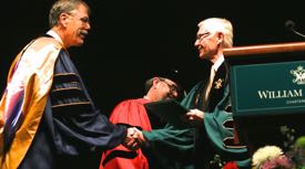 John Graves (L) receives the Thomas Ashley Graves, Jr. Award from W&M President Taylor Reveley (R). ©S. Salpukas/W&M.