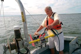 VIMS researcher Dr. Larry Haas deploys Acrobat, a towed instrument platform used to map oxygen-poor waters in Chesapeake Bay.