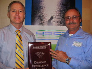 From L: Mr. Tom Grose, Director of Safety and Environmental Programs at VIMS, and Mr. Mark Rogers, VIMS Maintenance Supervisor, accept the Diamond Excellence Award during the Hampton Roads Sanitation District's annual Awards Ceremony. Photo courtesy of Nancy Munnikhuysen-HRSD.
