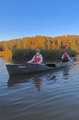 Meeting participants enjoy the fall colors during a canoe tour of Taskinas Creek. ©NERRA.