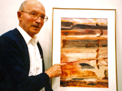 Professor emeritus Maynard Nichols with a piece of Bay-inspired artwork. 