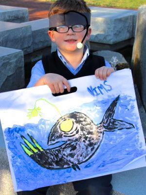 Johnny Vaughan, 7, won grand prize for his painting of an anglerfish. Here he channels the creature by donning his very own glow-in-the-dark anglerfish hat.