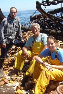 Dr. Bill DuPaul (C) joins with graduate students David Rudders (L) and Noelle Yochum (R) aboard a commercial scallop boat during a monitoring survey.