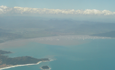 Aerial view of the Tijucas Strandplain. Note the large mud plume at the mouth of the Tijucas River (center). Photo courtesy of D. FitzGerald.